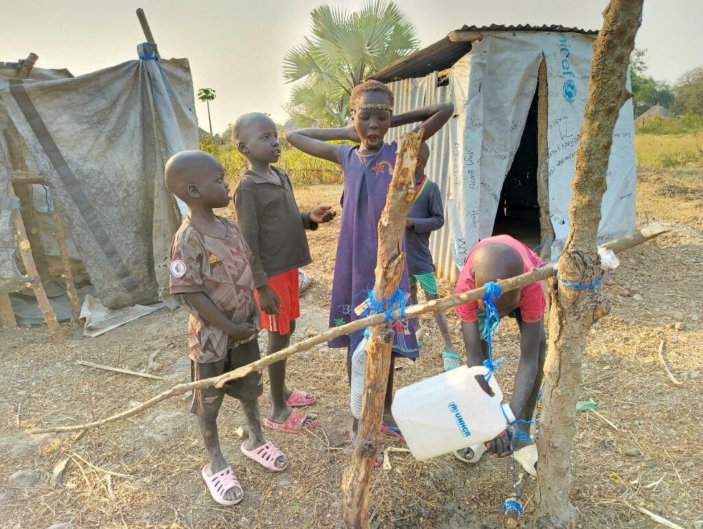 Children wash their hands as a result of Rhoda’s effort to demonstrate hand washing